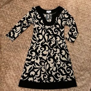 Sweet storm dress. Size S black cream swirls sexy stylishgreat for work stretchy